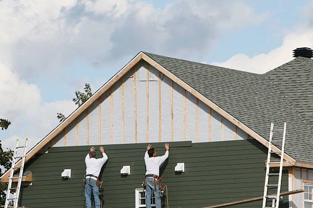 Professional Siding Replacement technician working in East Meadow, NY